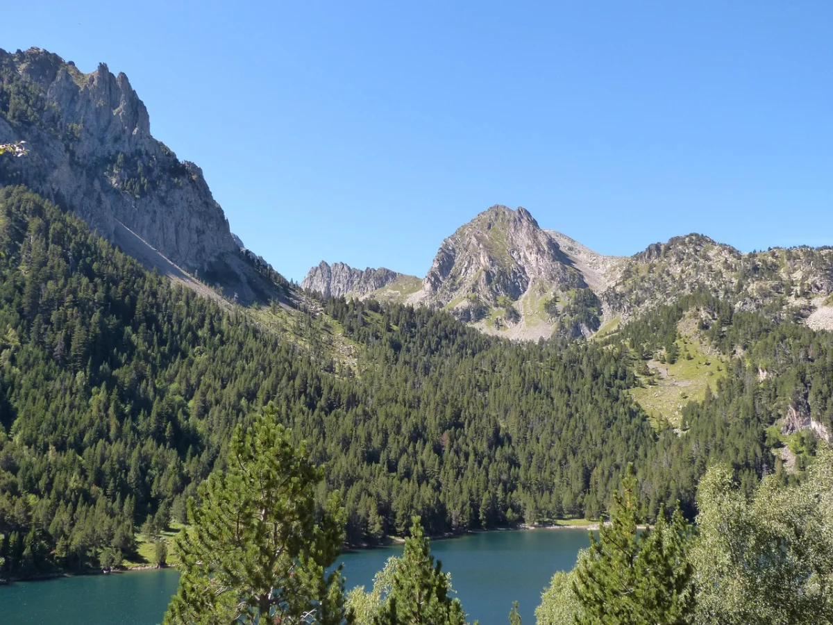 Estany de Sant Maurici lake beneath granite peaks in the Catalan Pyrenees