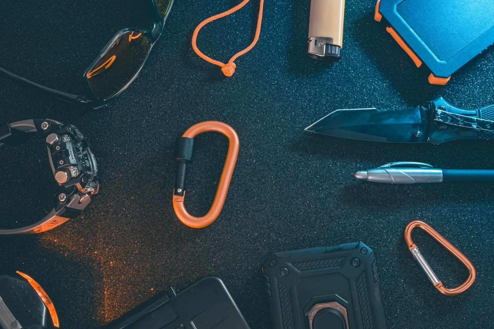 Essential outdoor gear arranged for a day hike