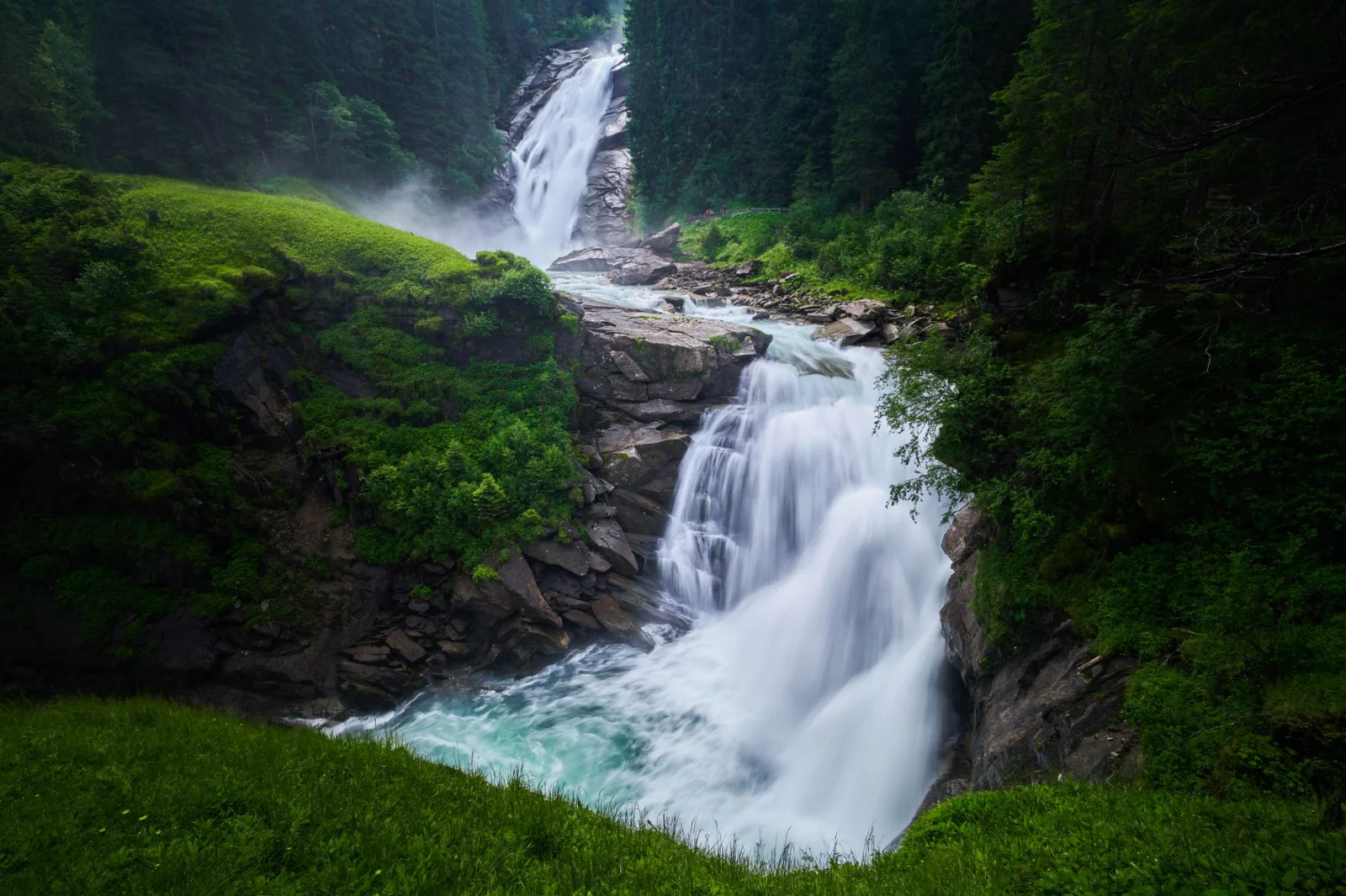 Explore the breathtaking Krimml Waterfalls surrounded by vibrant nature in Salzburg, Austria.