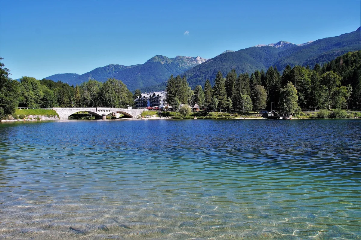 Lake Bohinj shoreline with the Julian Alps rising behind the water