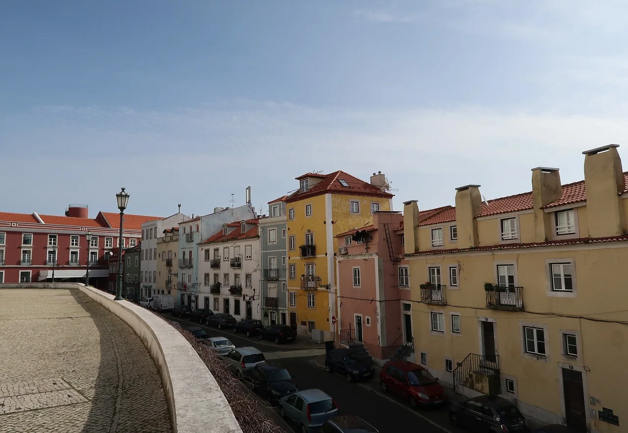 Steep pedestrian street climbing through Alfama in Lisbon