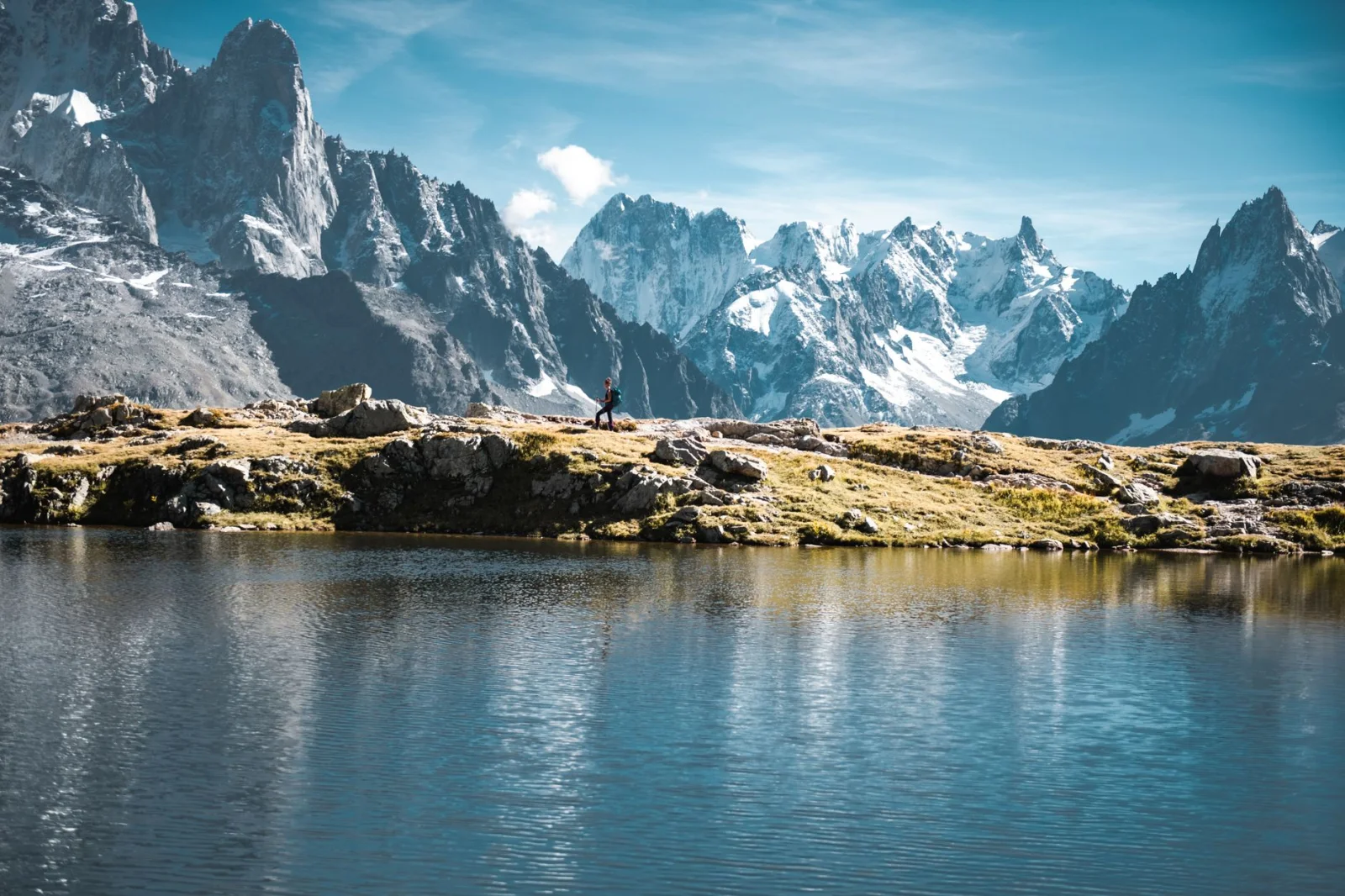 Hiker beside an alpine lake near Chamonix-Mont-Blanc