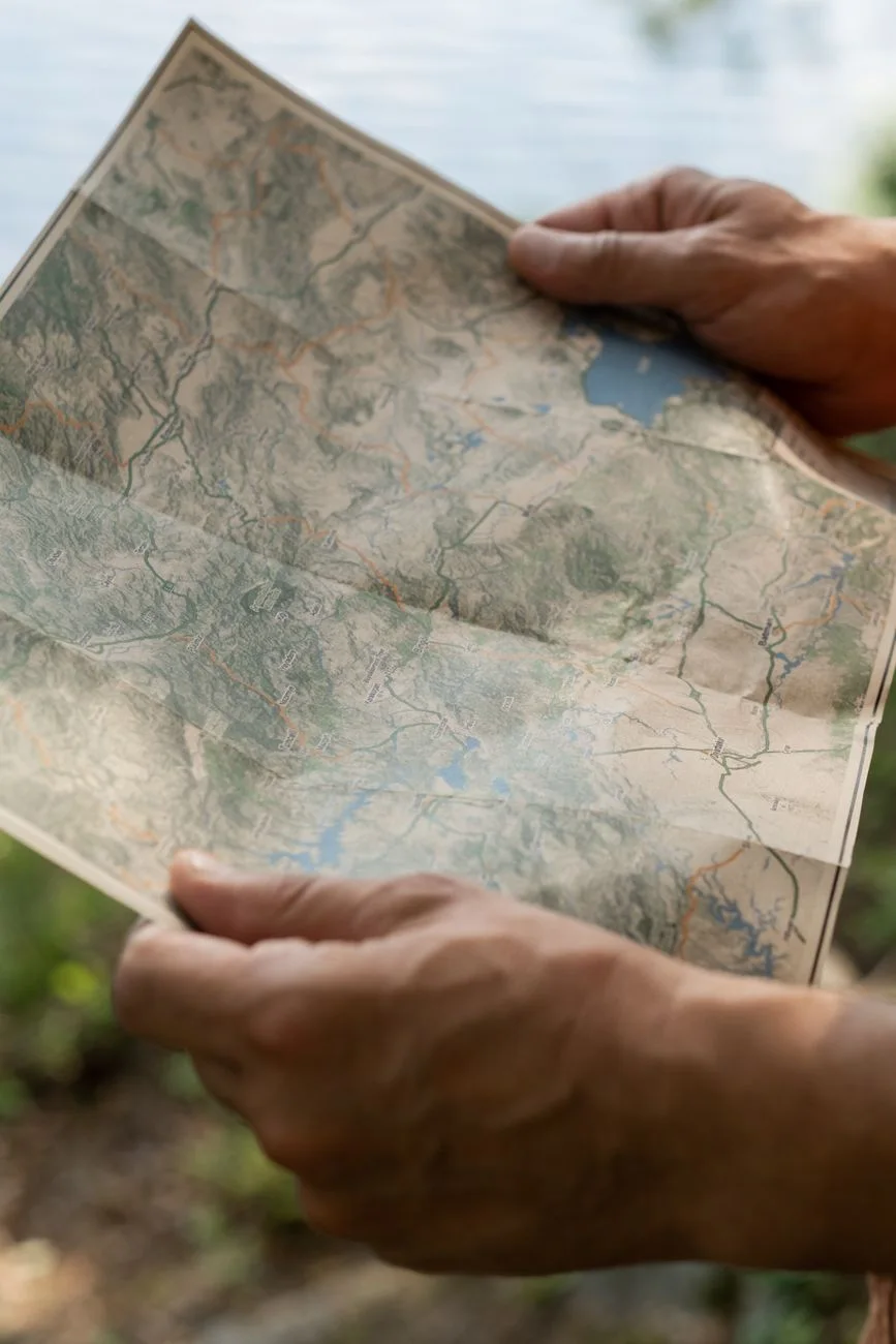 Hiker holding a map outdoors