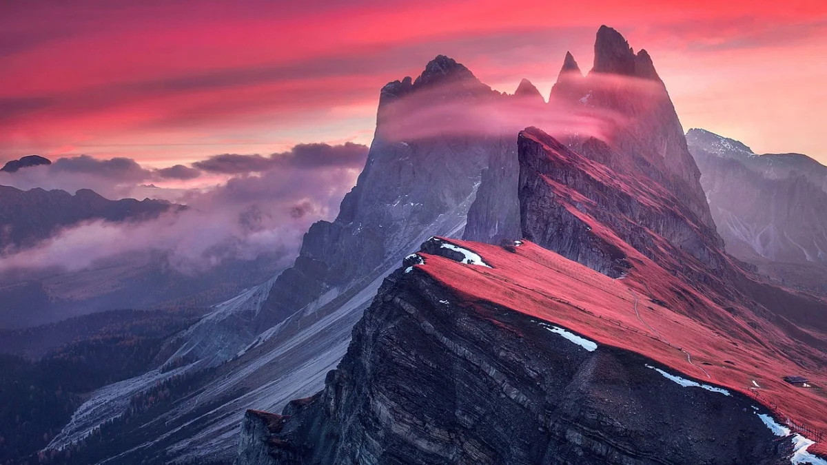 Puez-Odle peaks above the meadows near Passo delle Erbe in the Dolomites