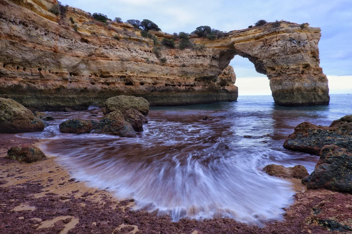 Sea arch and cliffs along the Seven Hanging Valleys Trail near Albandeira, Algarve