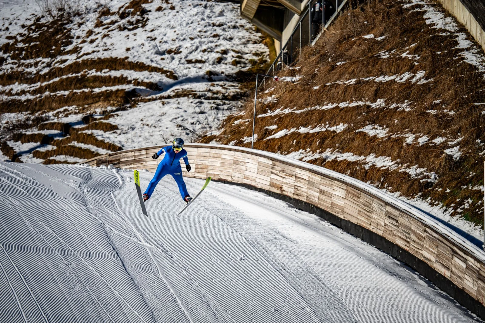 Ski jumper mid-air at Planica ski jumping hill, Slovenia